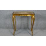 An Italian gilt occasional table with shaped top on slender cabriole supports. H.58 W.54 D.34cm