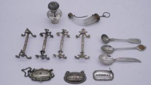 A collection of silver plate. Including four knife rests, spoons, drinks labels and a cut glass