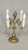 A vintage Continental brass four branch table candelabra. H.53cm