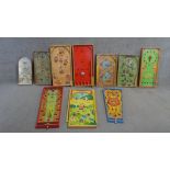 A collection of vintage painted wooden childrens tabletop games. Including various pinball and