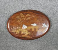 A hardwood inlaid Indian ivory and boxwood wall plaque with a procession of elephants on a bridge.