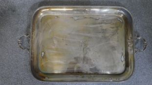 A large twin handled silver plated serving tray with inscribed back and enraved monogram to the