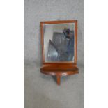 A 19th century mahogany wall hanging vanity mirror. H.70 W.40 D.24cm