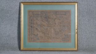 A framed and glazed 19th century map of the County of Chester. With scale bar and armorial crest