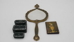 Three Victorian black papier-mâché snuff boxes inlaid with chips of abalone shell, and a shell