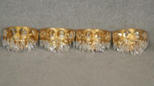 A set of four gilt metal basket form wall chandeliers with gilt drops. H.25cm