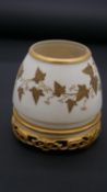 A Royal Worcester Victorian gilded ivy leaf vase with Chinese carved wooden stand design base.