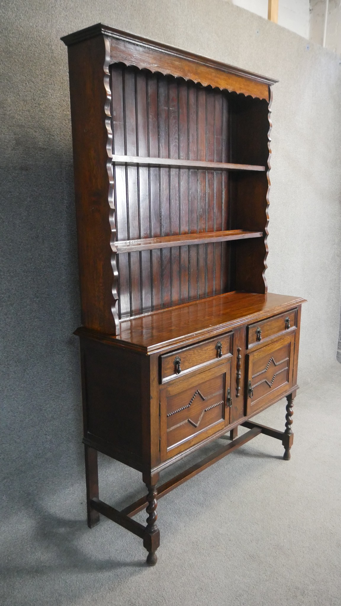 A George V oak dresser and rack, Jacobean style, the rack with three shelves, the base section - Image 3 of 3