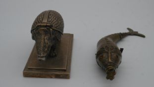 An antique silver plated novelty double ink well in the form of an armadillo on a rectangular