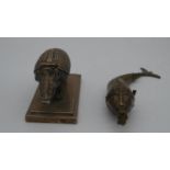 An antique silver plated novelty double ink well in the form of an armadillo on a rectangular