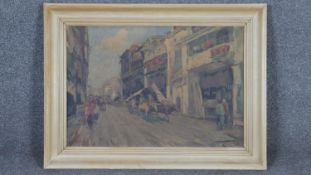 A framed oil on canvas, Chinese street scene. W.73 H.54