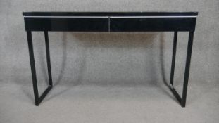 A contemporary console table fitted with a pair of frieze drawers. H.75 W.120 D.40cm