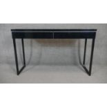 A contemporary console table fitted with a pair of frieze drawers. H.75 W.120 D.40cm