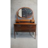 An Edwardian 'Sheraton Revival' mahogany dressing table, mirrored back with two small drawers, the