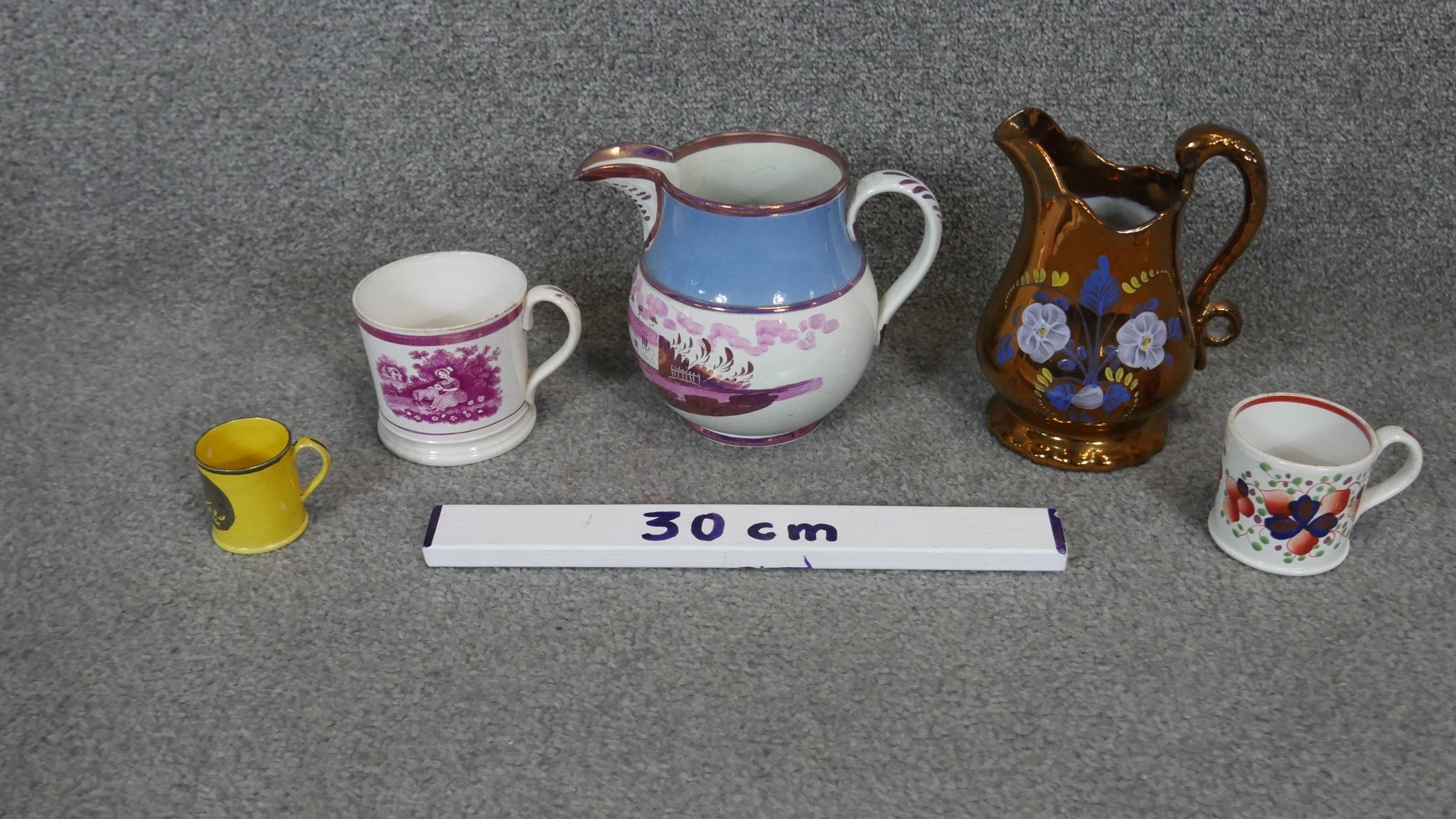 A collection of 19th century lustreware jugs and cups. Including a Sunderland ware jug painted - Image 3 of 7
