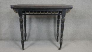 A 19th century ebonised and gilt Aesthetic style card table on turned tapering supports. H.70 W.90