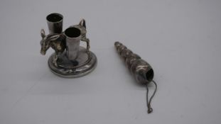 A novelty Spanish silver donkey cocktail stick holder along with a white metal (tested silver)