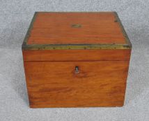 An early 19th century satinwood and brass bound box with fitted interior. H.21 W.29 D.26cm