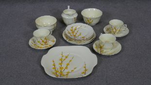 An antique Crown Staffordshire hand painted china tea set. Includes 3 cups with saucers, four