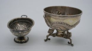 Two Chinese silver bowls. One by Wah Hing a repousse dragon design bowl on a triple dragon head form