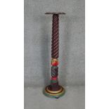 A mahogany spiral turned torchere with polychrome painted acanthus carved base. H.112cm