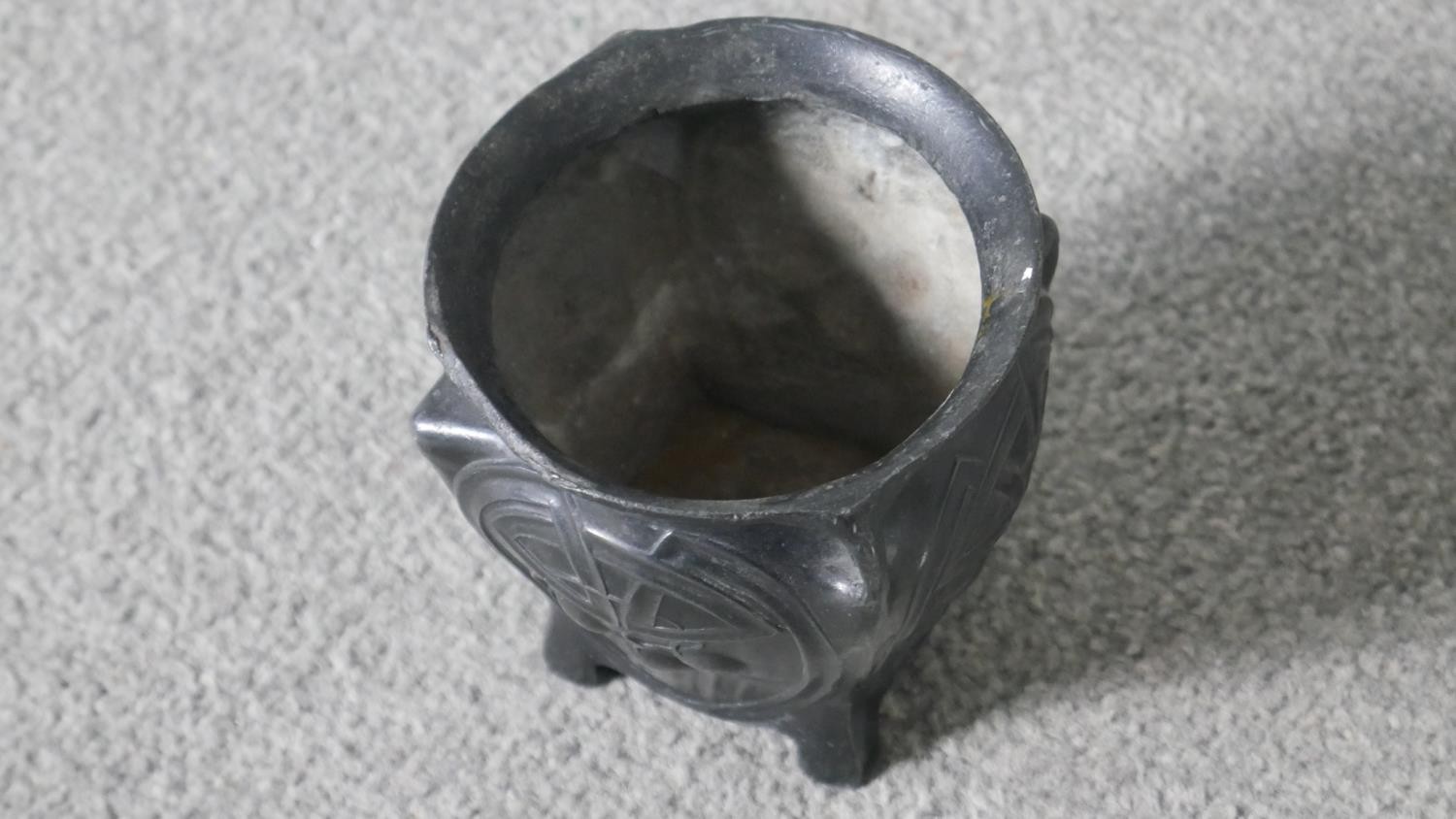 An Art Nouveau twin handled patinated pewter vase with stylised foliate and cherry design, on four - Image 3 of 3