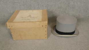 A vintage Herbert Johnson top hat and gloves in it's original box.