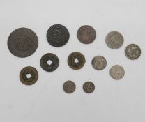 A collection of twelve Oriental coins. Including Chinese and Islamic coins.