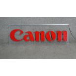 A vintage light up acryclic Canon camera advertising sign. (adapter and plug missing) H.36 W.100cm