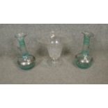A collection of glass ware. Including a pair of silvered blown glass carafes and a cut crystal vase.
