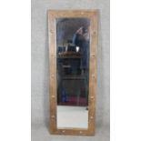 An Eastern dressing mirror in hardwood studded frame. H.123 W.46cm