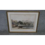 A framed and glazed watercolour landscape of a house by a lake. Signed. H.46 W.59cm