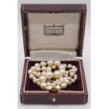 A 18 inch graduated and knotted cultured pearl necklace with 9 carat white gold clasp. Largest pearl