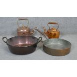 A collection of copper and brass kitchenware. Including two Victorian copper kettles, one engraved
