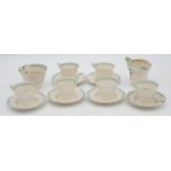 A six person Soho pottery Solian ware green floral pattern coffee set. Maker's mark to the base.