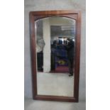 A mid century antique style full height oak mirror with arched bevelled plate. H.188 W.78cm (