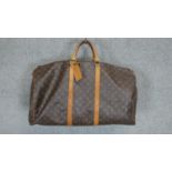 A Louis Vuitton "Keepall" 60, date code: MI1911, Monogram canvas exterior with leather trim, dual