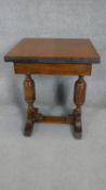 A mid century Jacobean style oak drawer leaf table of small size. H.72 W.80 D.60 (105cm fully
