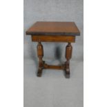 A mid century Jacobean style oak drawer leaf table of small size. H.72 W.80 D.60 (105cm fully
