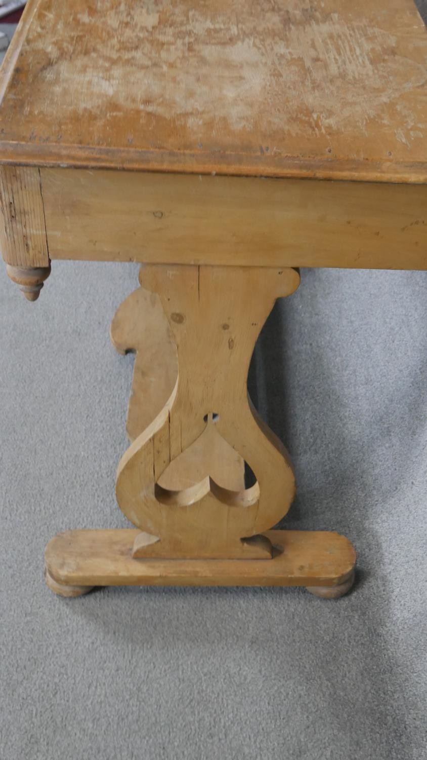 A 19th century pine two drawer side table on stretchered shaped supports. H.78 W.101 D.53cm - Image 4 of 4