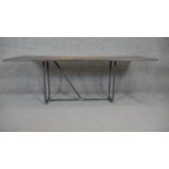 An industrial style metal topped low table. H.60 W.87 D.54cm
