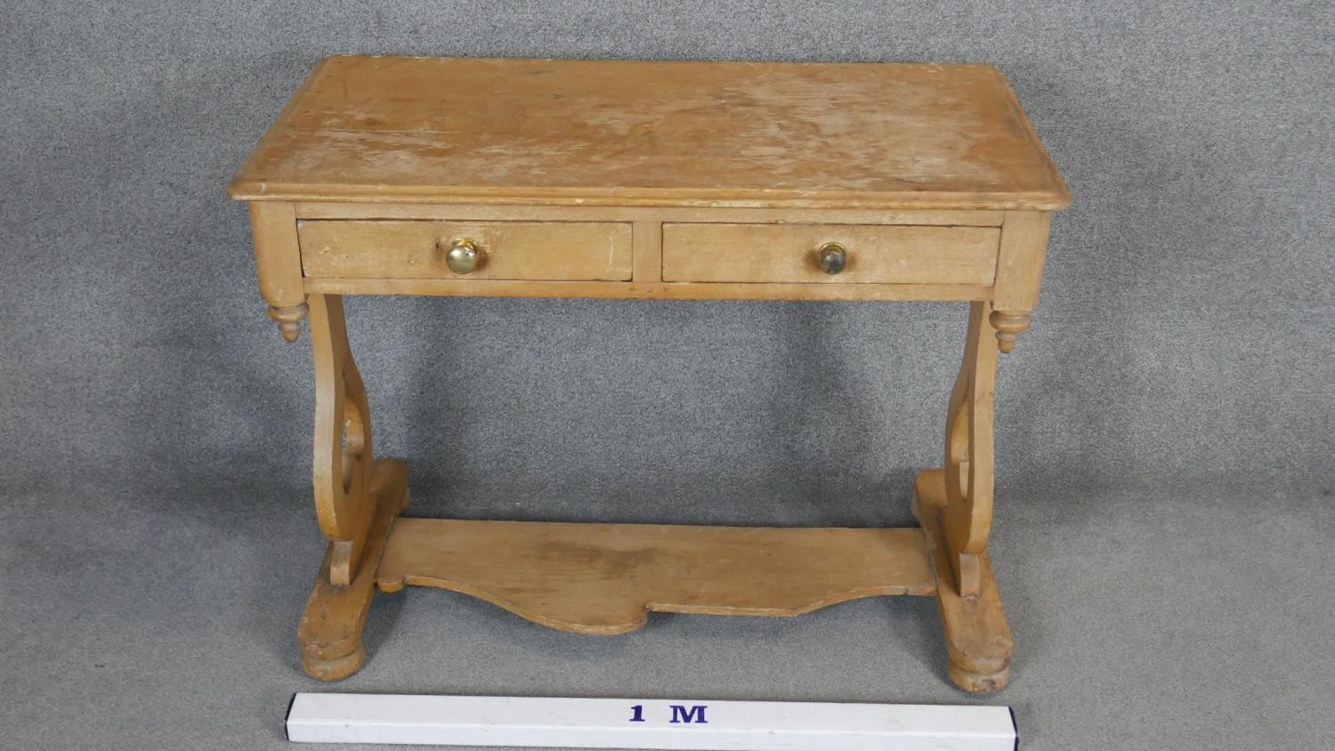 A 19th century pine two drawer side table on stretchered shaped supports. H.78 W.101 D.53cm - Image 2 of 4