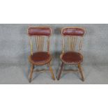 A pair of late 19th century oak stick back chairs.
