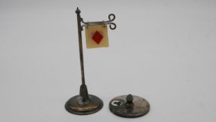 An EPNS bridge card suit stand and silver card suit spinner. Spinner hallmarked: Gy & Co for