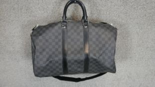 A Louis Vuitton, "Keepall" travel bag 45. Damier Graphite canvas with black leather trims. Date