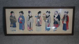 A framed and glazed Chinese silk stumpwork of seven figures all in traditional clothing, hand