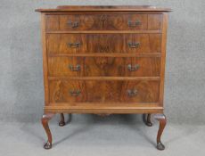 A mid century Georgian style figured walnut chest on cabriole supports. H.107 W.90 D.52cm