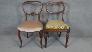 A 19th century mahogany balloon back dining chair along with a similar example.