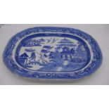 A large 19th century blue and white willow pattern ceramic meat platter. Impressed numbers to the