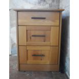 A contemporary light oak three drawer filing cabinet. H.70 W.52 D.50cm